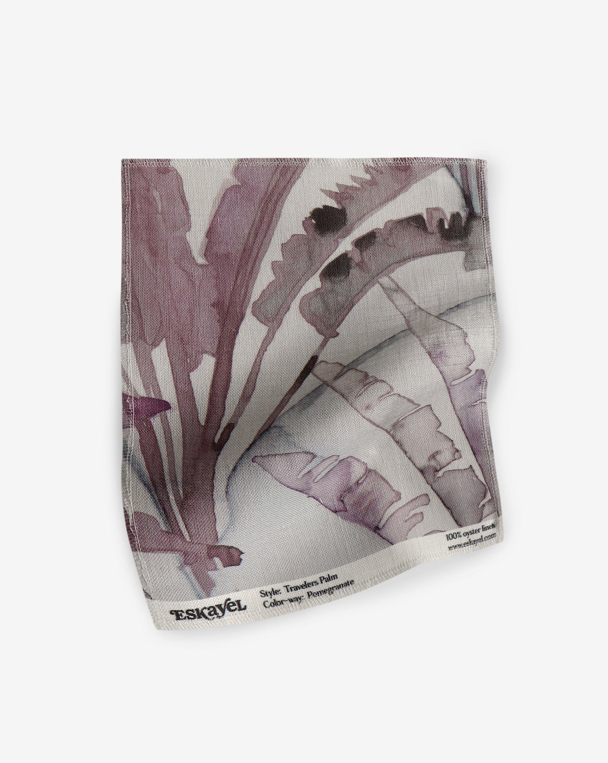 a Travelers Palm Fabric Sample Pomegranate with a purple and white pattern on it