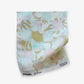 Yaya fabric in Brisa as a swatch — beach-themed graphic botanical wallpaper in turquoise, taupe, and light pink | Eskayel