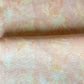 Yaya fabric in Grapefruit — beach-themed graphic botanical fabric in pale peach with highlights of light yellow | Eskayel