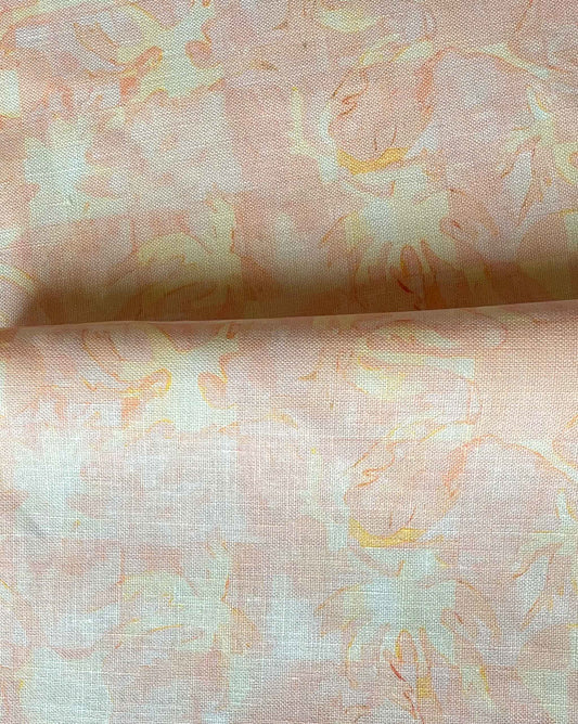 Yaya fabric in Grapefruit — beach-themed graphic botanical fabric in pale peach with highlights of light yellow | Eskayel