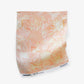 Yaya fabric in Grapefruit as a swatch — beach-themed graphic botanical fabric in pale peach with highlights of light yellow | Eskayel