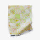 Yaya fabric in Limeade as a swatch — beach-themed graphic botanical fabric in light yellow, lime green, and peach | Eskayel