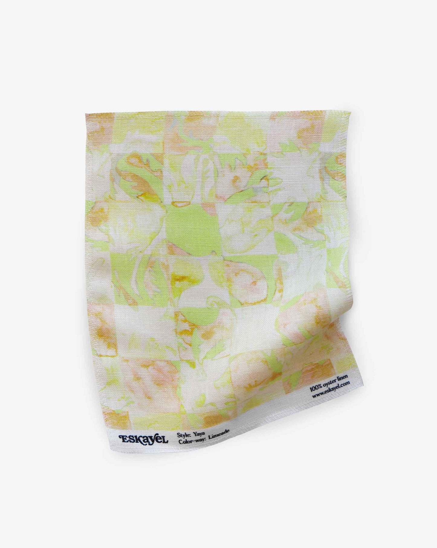 Yaya fabric in Limeade as a swatch — beach-themed graphic botanical fabric in light yellow, lime green, and peach | Eskayel