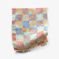 Yaya fabric in Punch as a swatch — beach-themed graphic botanical fabric in bright pink, peach, periwinkle blue, and pale turquoise | Eskayel
