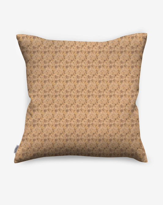 Pillows in Eskayel’s Alhelí, a tiny repeating fabric pattern inspired by tropical living, in the beige-based colorway Frangipani.