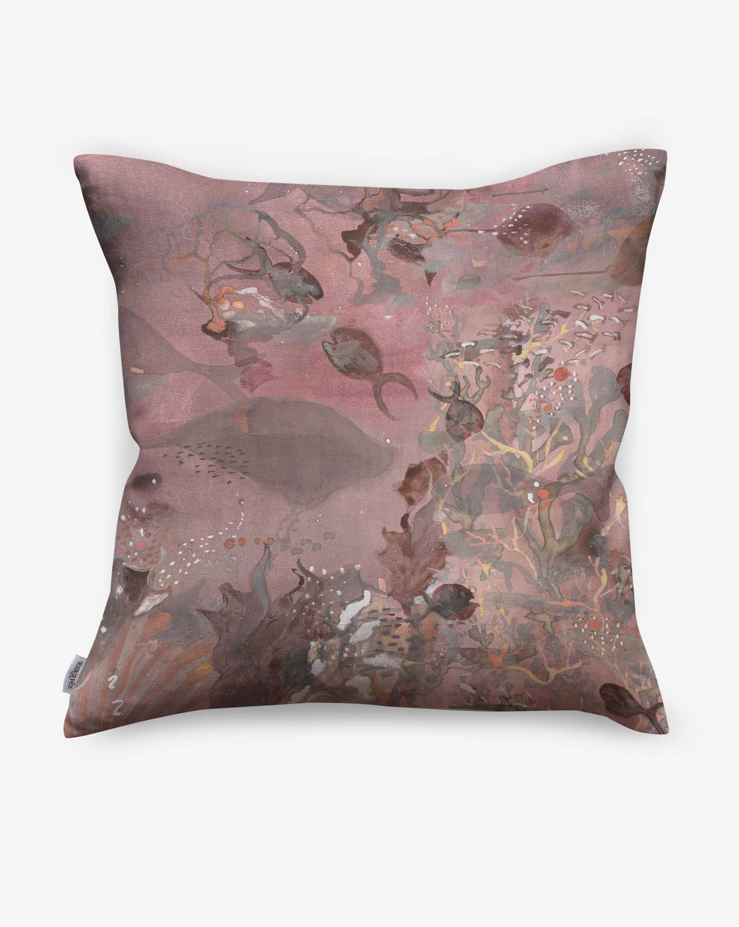 Atoll pillows by Eskayel in the Coral colorway incorporate beautiful pink and red tones.