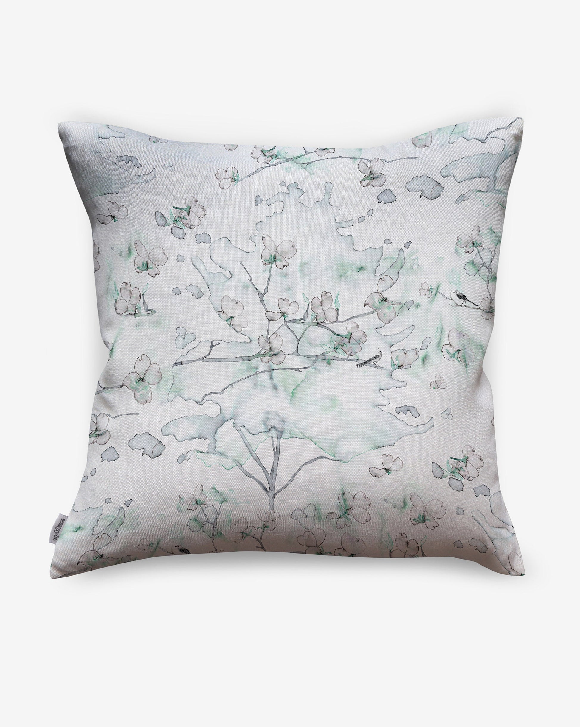 Inspired by nature, Dogwood Dreams pillows in Spruce feature shades of greens, blues, and pinks.