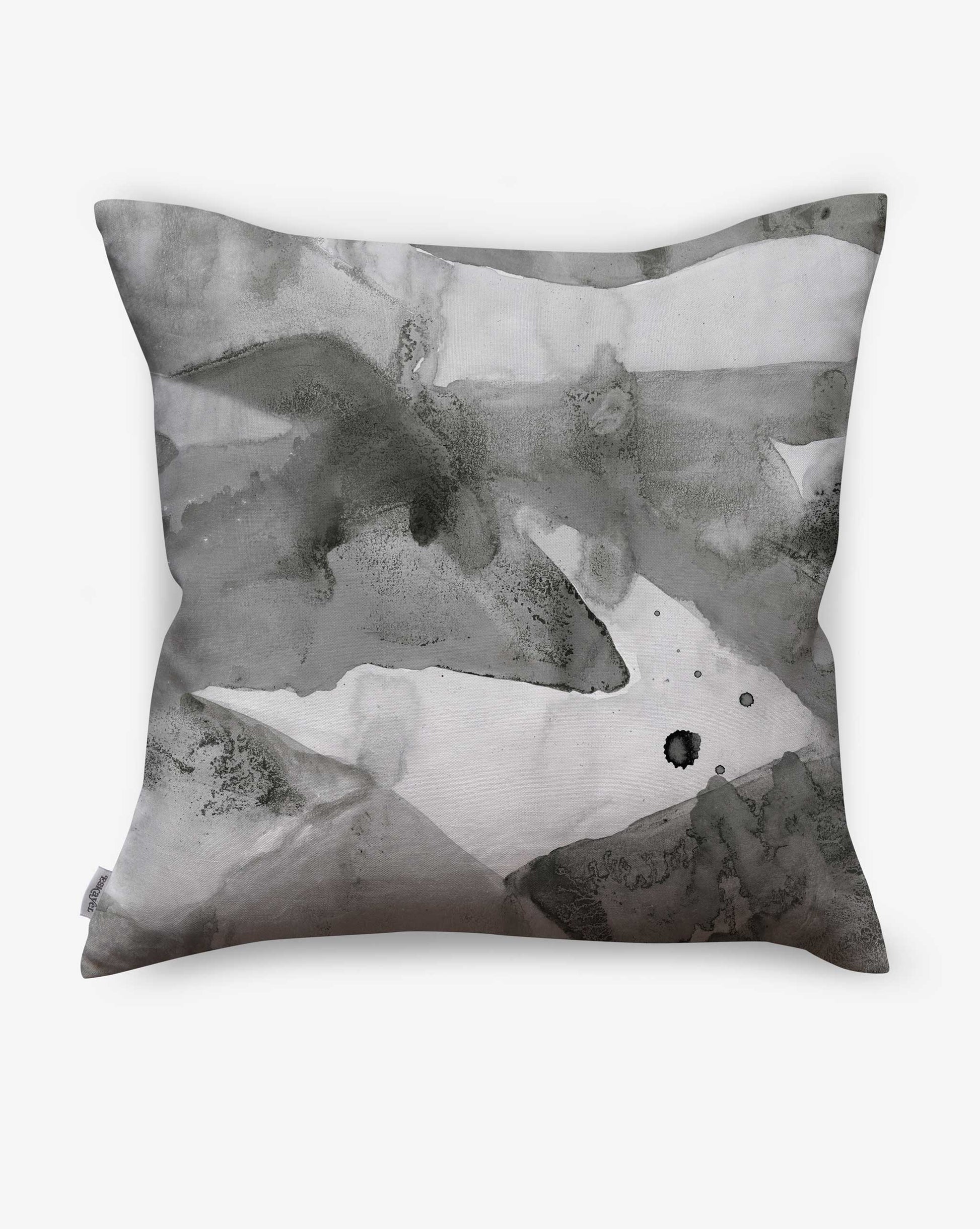 A Mani Pillow in the colorway Phyllite with a river and monutains in a hues of black, grey, and white.