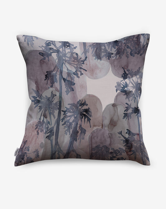 Depicting silhouettes of a tropical tree, luxurious Papaya Arc pillows in our Pomegranate colorway feature blue, purple and grey