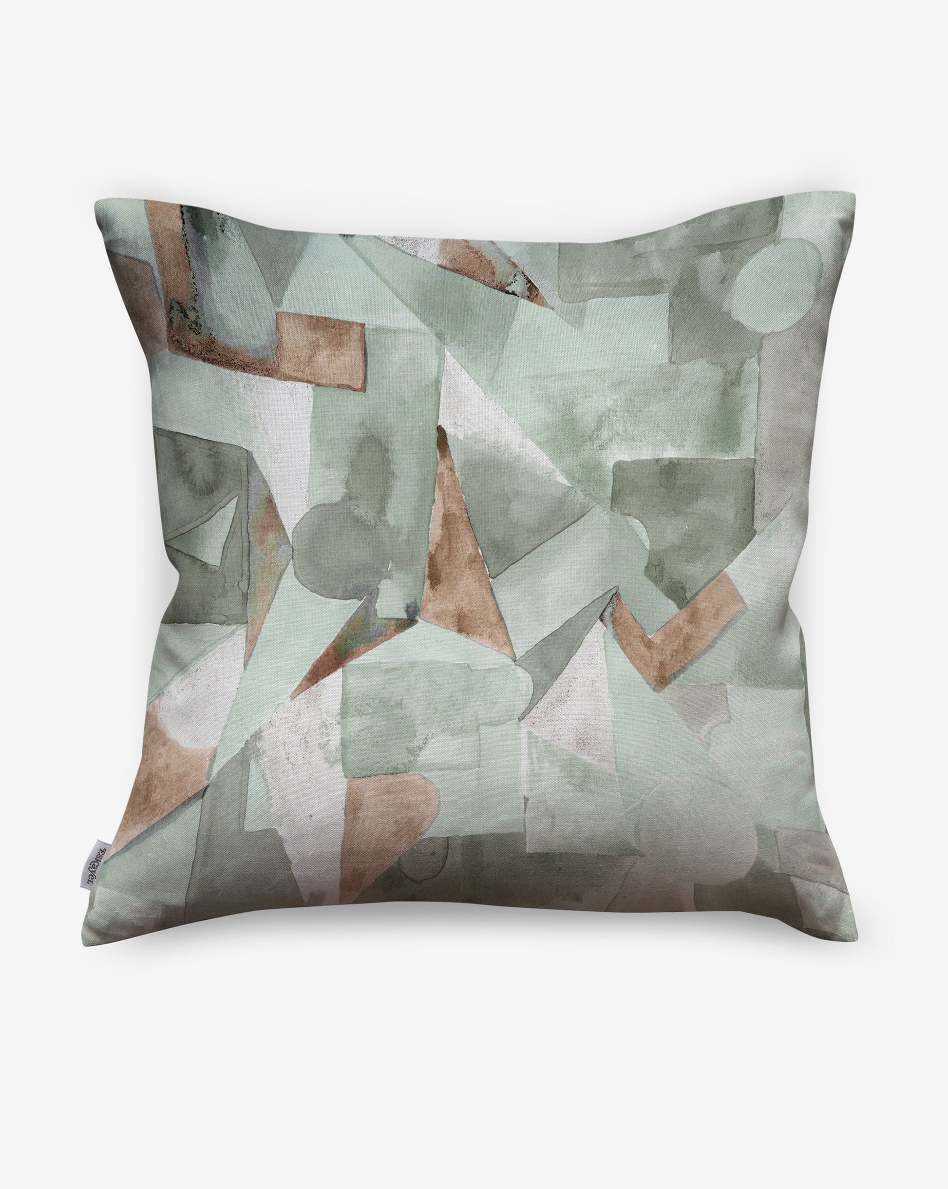 In Pieces pillows in Tourmaline, green blocks of pigment depict puzzle pieces.  