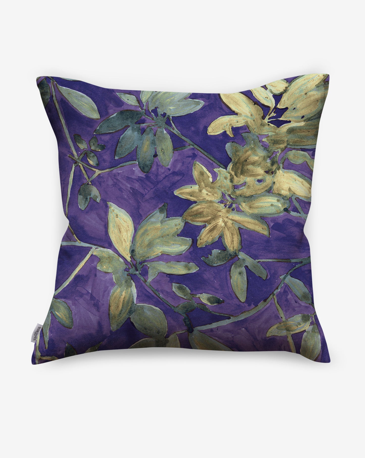 A photo of Eskayel’s Plumeria Shadows pillows in Eggplant, a colorway of purple with green tones.