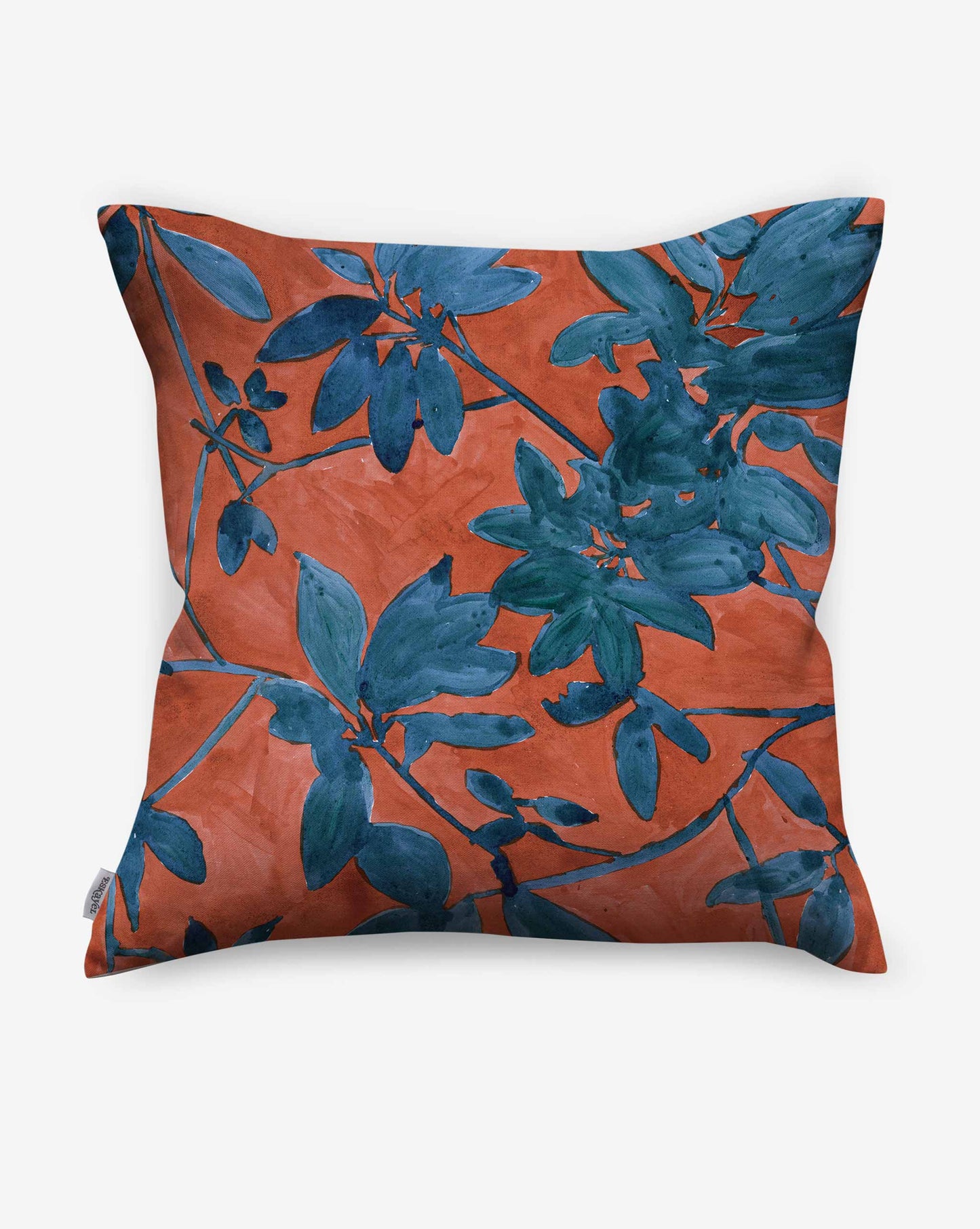 A swatch of Eskayel’s Plumeria Shadows pillow pattern in Hibiscus, a colorway featuring a rich red background.