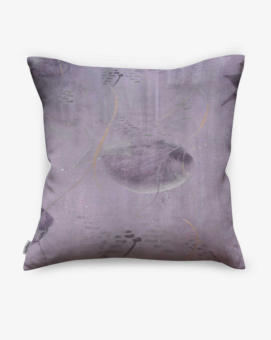 Pillows made of Shoal fabric in the Cay colorway depict an underwater composition in purple.