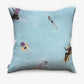 The Swim Pillow Sea is a light blue cover featuring a playful print of people swimming and floating in a pool, as seen from above on the back.