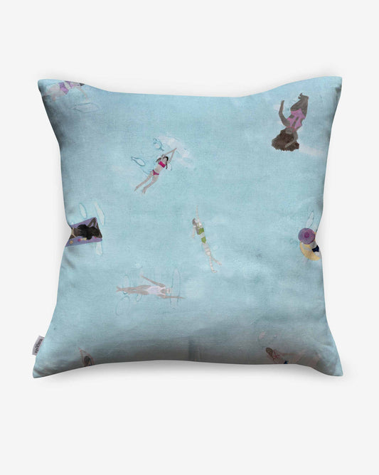 A Swim Pillow||Sea in a sea colorway, featuring a swim fabric print with small, colorful illustrations of people swimming and relaxing in various positions. Perfect for adding a touch of whimsy to your beach house decor.