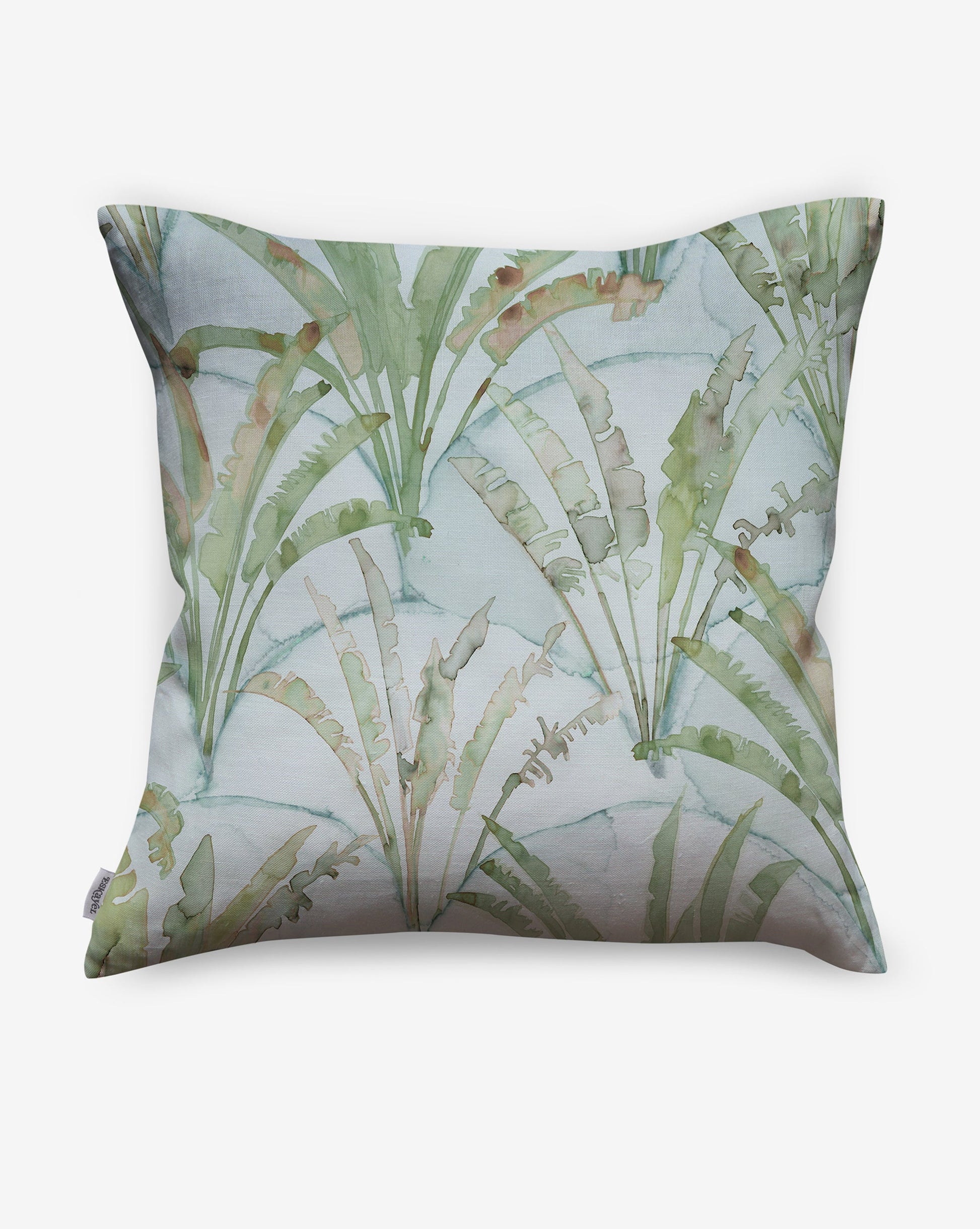 Featuring palms on a geometric scallop backdrop, Travelers Palm pillows in Sage incorporate shades of green and blue.