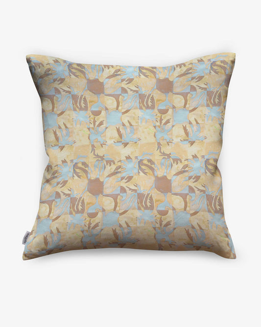 Yaya pillow in Husk as a swatch — beach-themed graphic botanical pattern in creamy yellow, earthy brown, and light blue | Eskayel