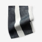 A black and white striped fabric from the Bold Stripe Performance Fabric Slate Collection on a white background