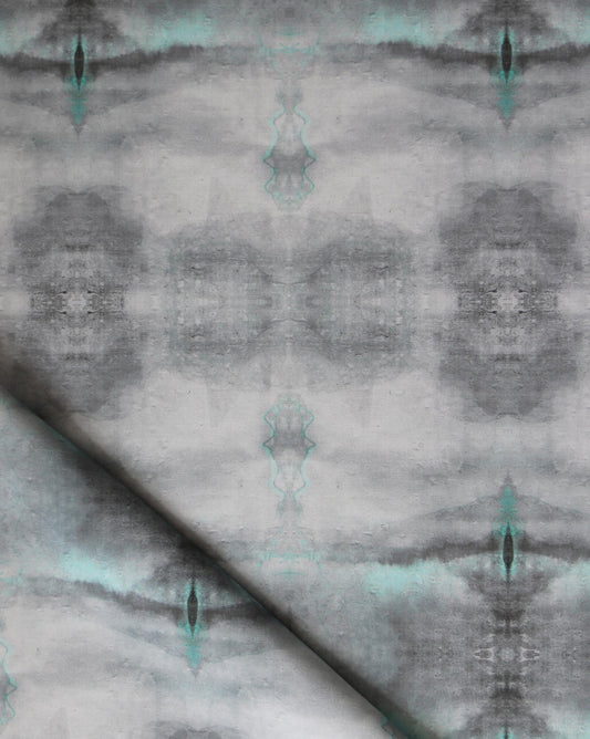 A grey and Viridian fabric with a Poolside Performance Fabric abstract design