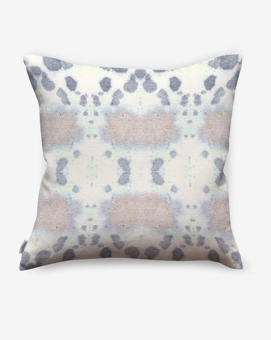 The Species Outdoor Pillow Hide features a soft, abstract watercolor pattern in pastel gray, purple, and beige on white luxury performance fabric for lasting comfort outdoors.