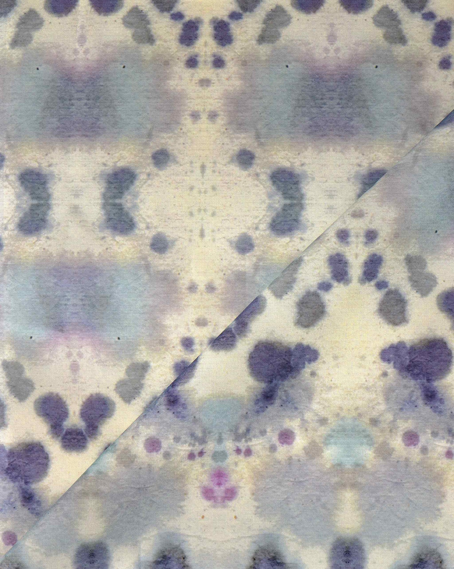 Eskayel's Species Waterstone pattern with its kaleidoscopic effect showcasing blue and purple colors on performance fabric.