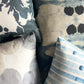 Close-up of patterned pillows with abstract designs.