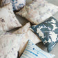 Set of decorative pillows with various patterns on a neutral background
