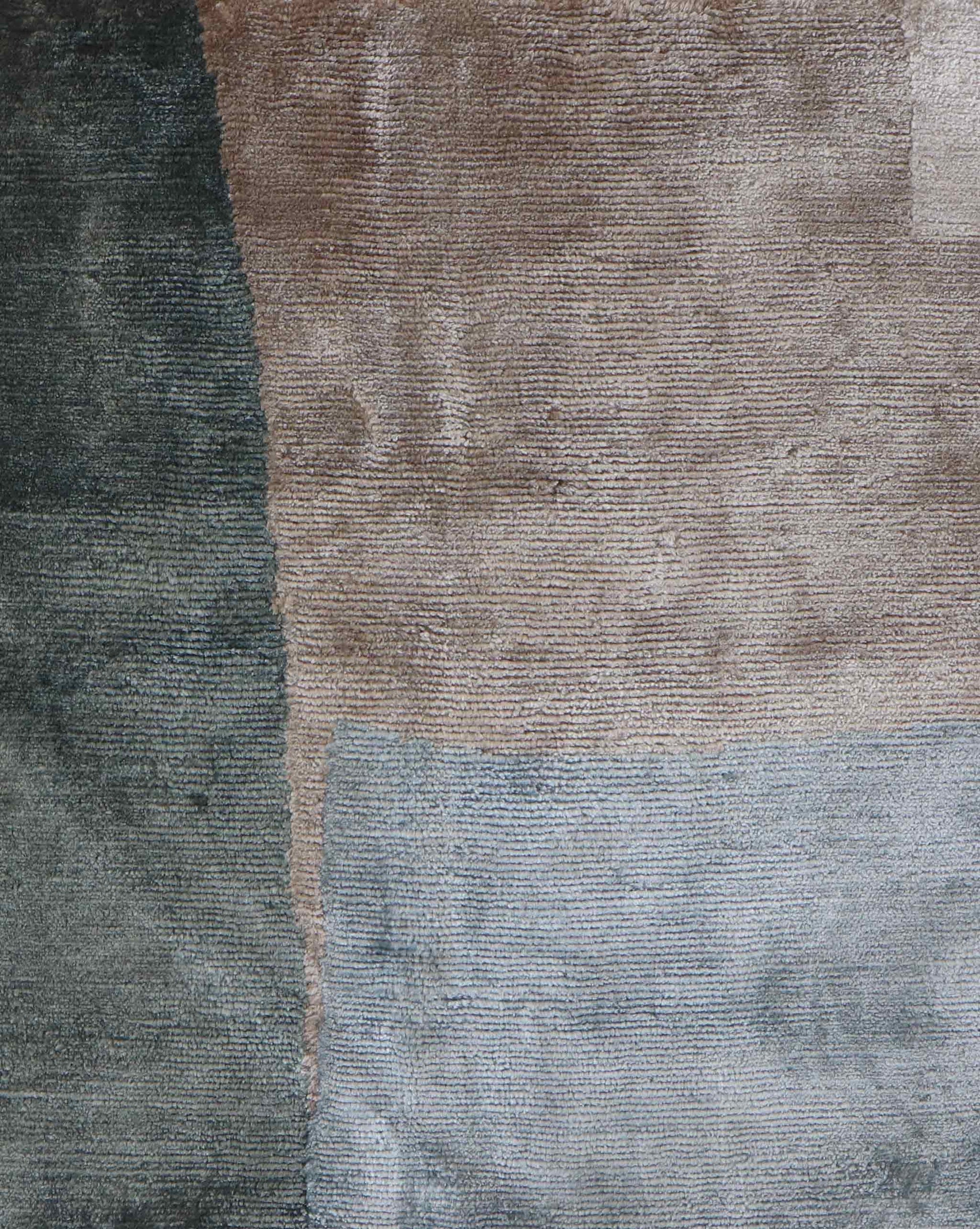 A close up image of the Blocked rug in Land.