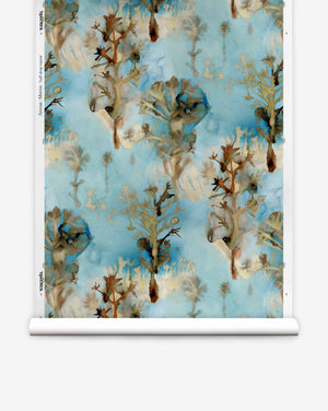 Aionas Silk Wallcovering||Morea paper-backed wallpaper roll featuring a watercolor pattern of brown, leafless trees on a bright blue background.