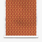 A roll of Alhelí Silk Wallcovering in Golden Hour, featuring a repeating pattern of dark red autumn leaves on a warm, golden-orange background.