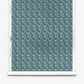 A roll of Alhelí Silk Wallcovering in Tide Pool, featuring a dense, repeating botanical pattern of cream-colored flowers and teal foliage on a dark blue background.