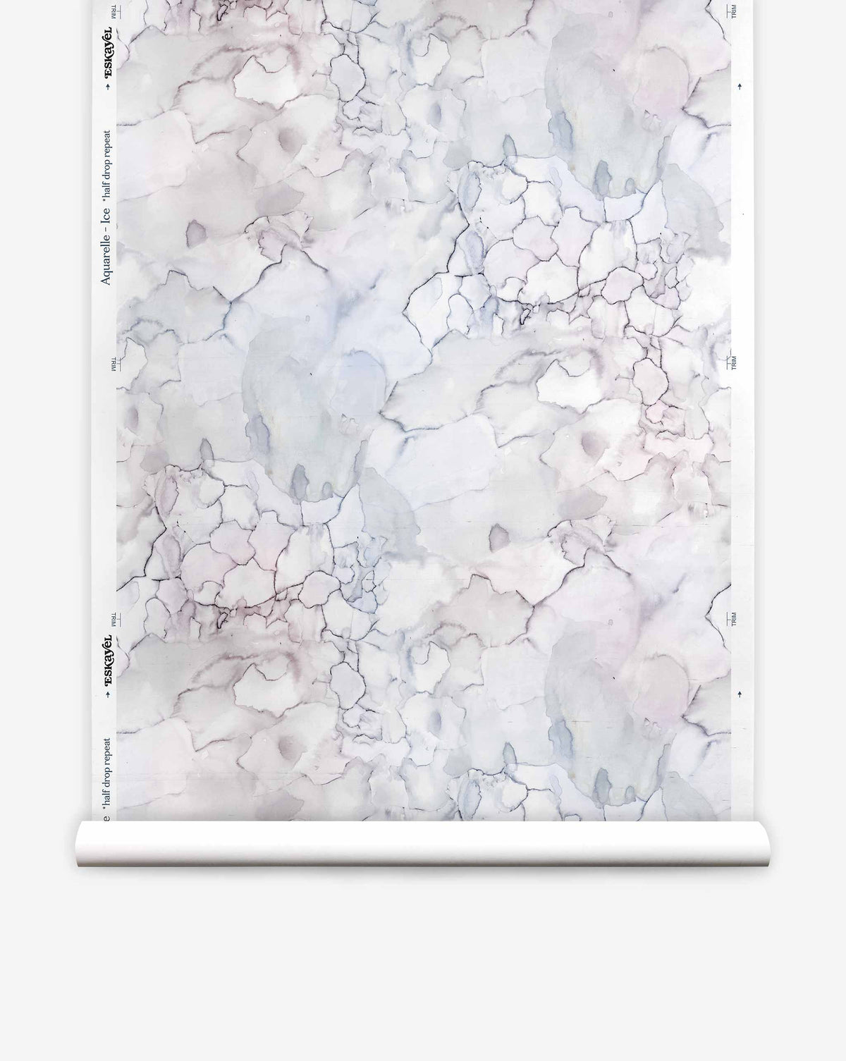 A roll of Aquarelle Silk Wallcovering in Ice, featuring a pale, marbled watercolor pattern in shades of grey, blue, and violet.