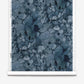 A roll of Aquarelle Silk Wallcovering in Ocean, featuring an abstract dark blue ink wash pattern with cracked, vein-like dark lines.