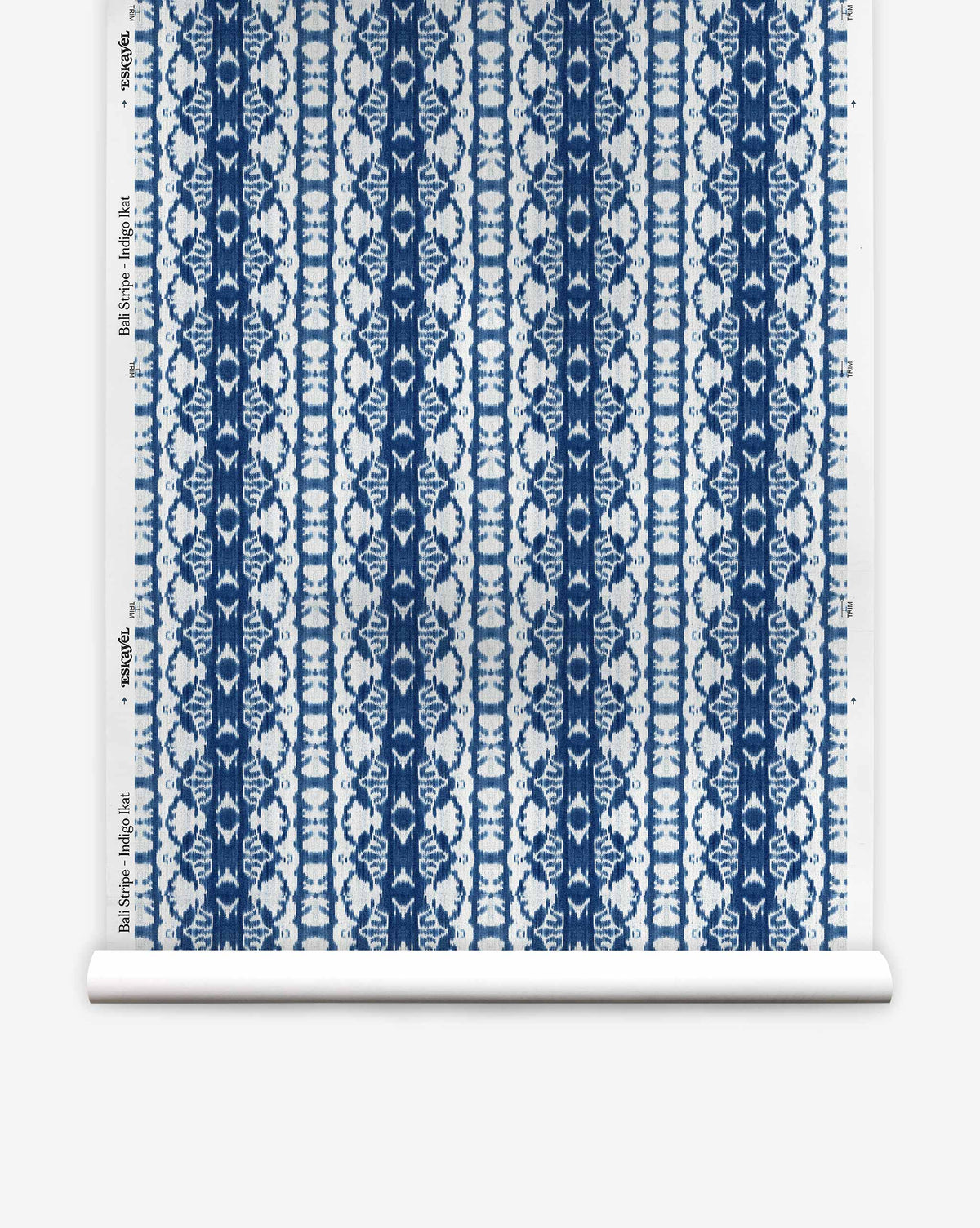 A roll of Bali Stripe Silk Wallcovering in Indigo Ikat, featuring a vertical indigo and white stripe pattern.