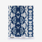 A Bali Stripe Silk Sample in Indigo Ikat featuring a blue and white ikat stripe pattern, with a label at the bottom detailing how to order a sample.