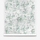 A roll of Bosky Toile Silk Wallcovering | Chloros featuring a luxury abstract green and white botanical pattern.
