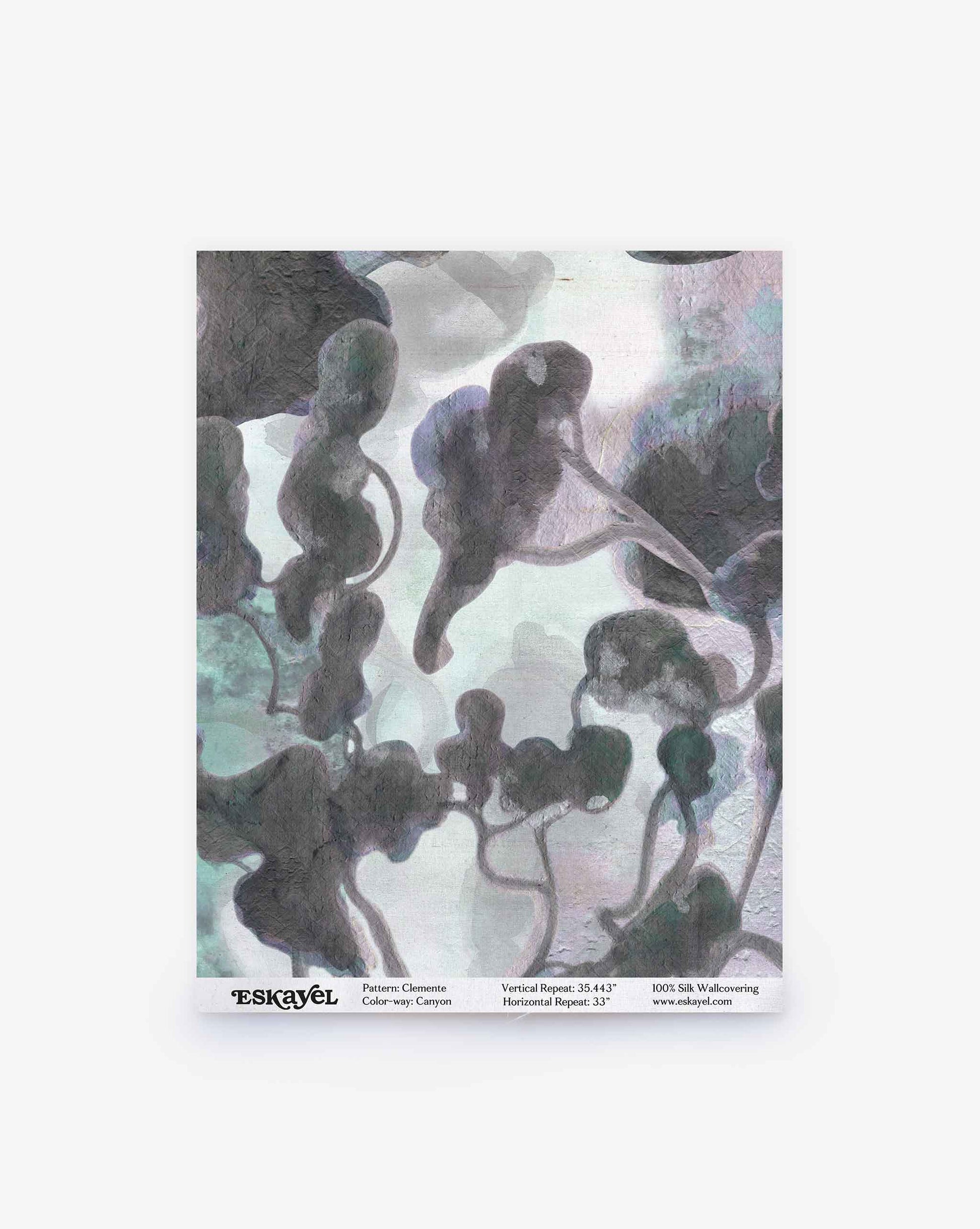 Clemente Silk Sample || Canyon wallpaper features abstract, organic shapes in gray, black, and muted green tones set against a pale background. Product details such as the pattern name and company appear below. Order a sample to experience this unique design for yourself.