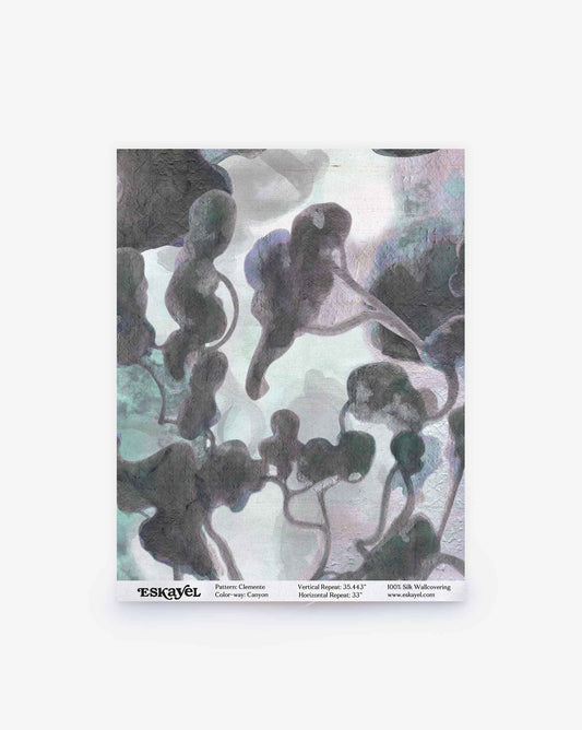 Clemente Silk Sample || Canyon wallpaper features abstract, organic shapes in gray, black, and muted green tones set against a pale background. Product details such as the pattern name and company appear below. Order a sample to experience this unique design for yourself.