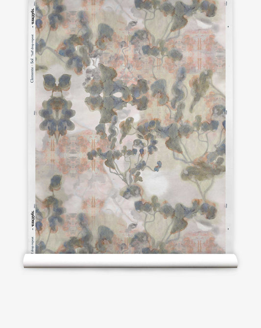 The Clemente Silk Wallcovering||Sol showcases an abstract, watercolor-style floral pattern in muted green, gray, and peach tones inspired by Southern California design.