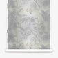 A roll of Cocos Silk Wallcovering||Bare, featuring a muted, abstract botanical pattern in shades of gray and white, is displayed vertically against a white background.
