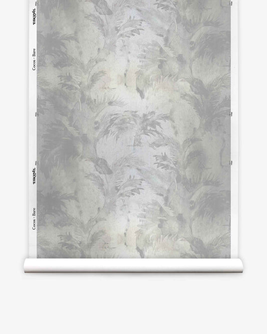 A roll of Cocos Silk Wallcovering||Bare, featuring a muted, abstract botanical pattern in shades of gray and white, is displayed vertically against a white background.