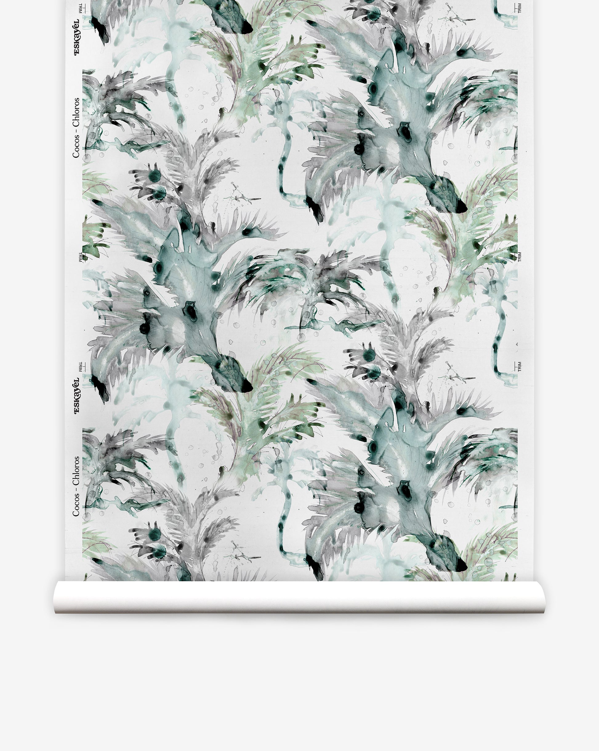 A roll of Cocos Silk Wallcovering||Chloros featuring a watercolor-style pattern with abstract leaves, palm tree motifs, and botanical shapes in shades of green, gray, and black.
