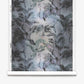 A roll of Cocos Silk Wallcovering in the Dove colorway, featuring a dark, abstract watercolor pattern with brush-like strokes and shapes in shades of blue, black, and gray.