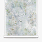 A roll of Cortile Silk Wallcovering||Aqua featuring a pale, abstract botanical design in soft watercolor shades of white, green, and blue, displayed against a white background.