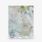 A square sample of the Cortile Silk Wallcovering in the Aqua colorway, featuring a green and white abstract watercolor pattern, is displayed against a white background with design information printed along the bottom edge.