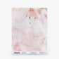 Sample sheet of Cortile Silk Wallcovering||Pelle in a soft pink and white abstract design, reminiscent of a delicate watercolor pattern, with product details printed along the bottom edge.
