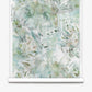 A roll of Cortile Silk Wallcovering||Verde features a watercolor pattern with abstract white tropical leaves and light green, blue, and beige backgrounds, evoking the serene beauty of an Italianate garden.