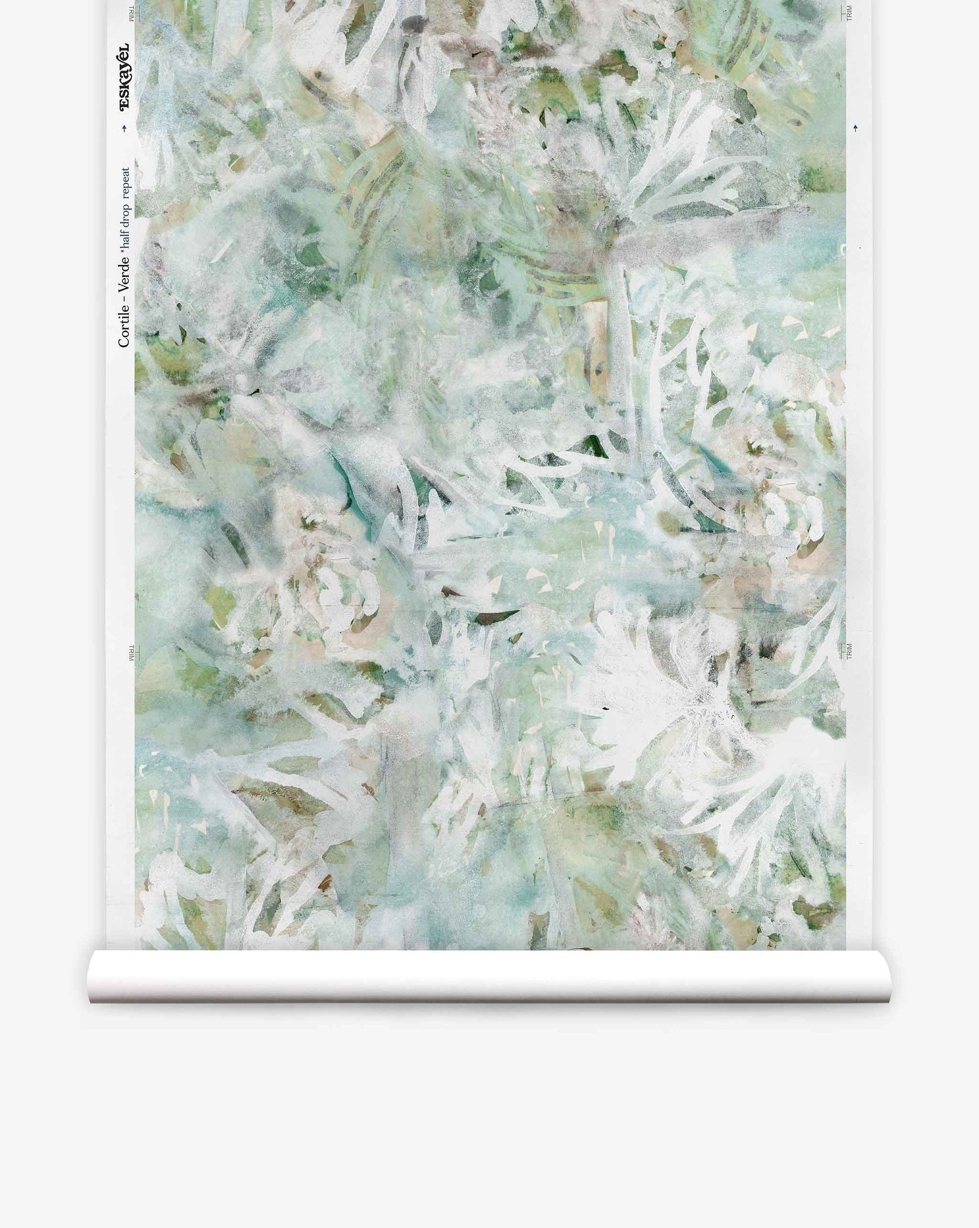 A roll of Cortile Silk Wallcovering||Verde features a watercolor pattern with abstract white tropical leaves and light green, blue, and beige backgrounds, evoking the serene beauty of an Italianate garden.