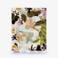 A Pétalos Silk Sample||Abalone featuring an abstract floral pattern in green, pink, and yellow tones set against a white geometric background. The “Eskerel” logo is displayed at the bottom. Order a sample to experience this vibrant design firsthand.