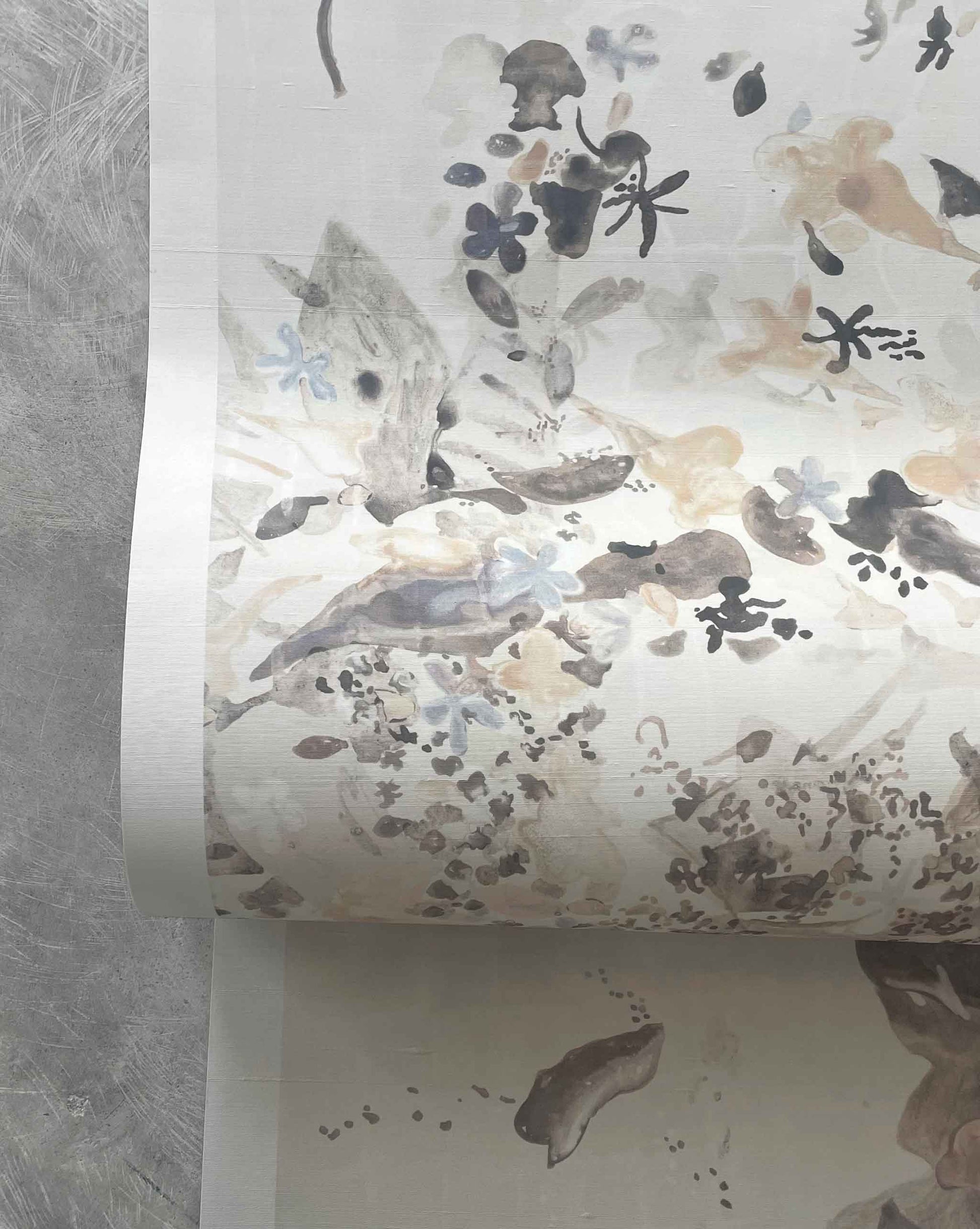 Shown flowing off a roll, Eskayel’s Pétalos silk wallpaper in Sand Dollar is a neutral palette of pearl, cream, and oyster tones.